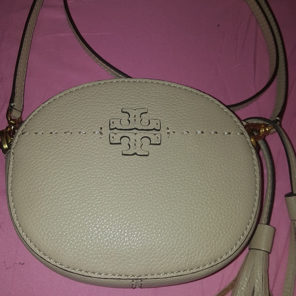 Tan Tory Burch tasseled round crossbody